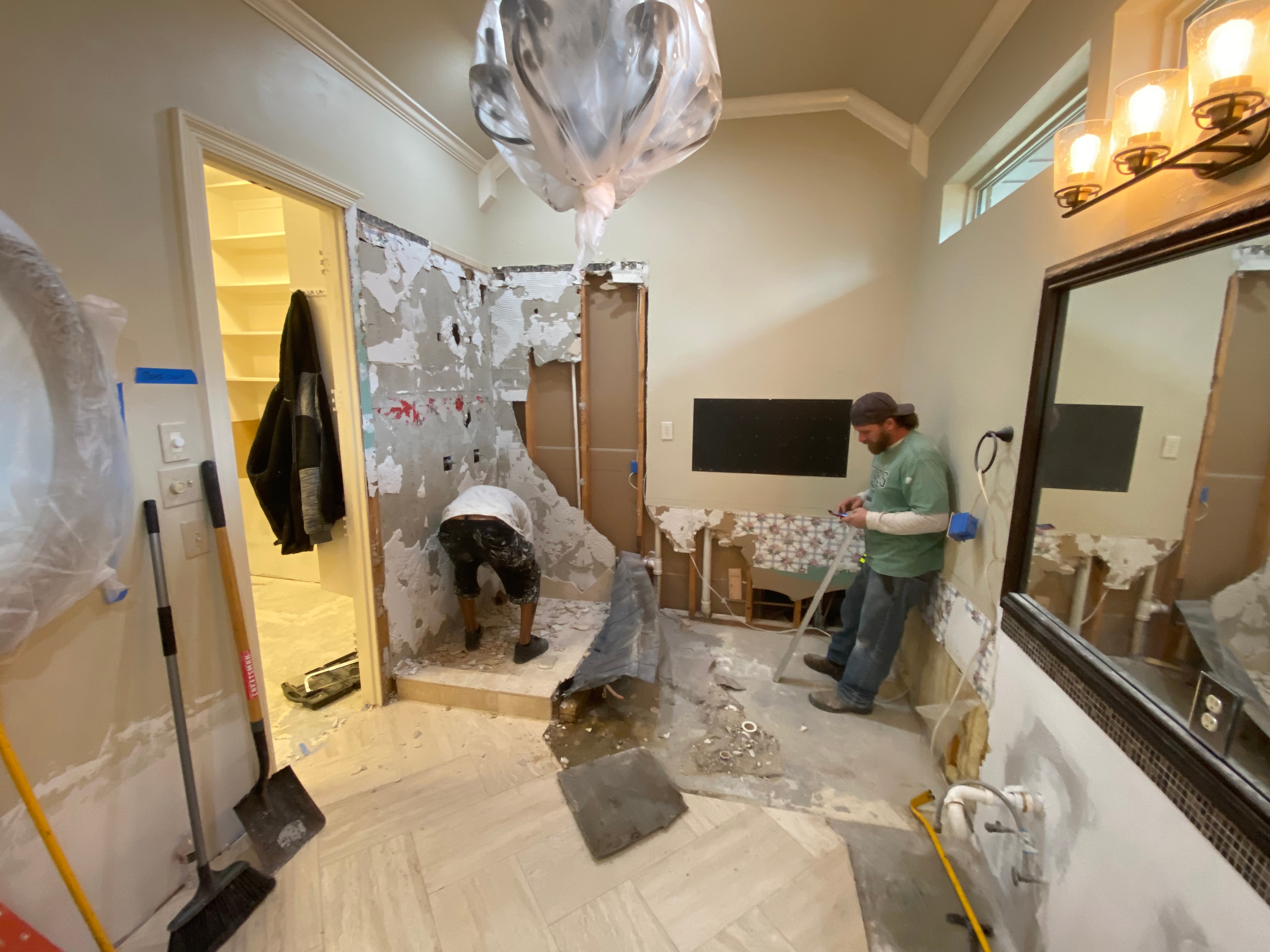 Luxury bathroom remodel with brass fixtures and freestanding tub — North Texas