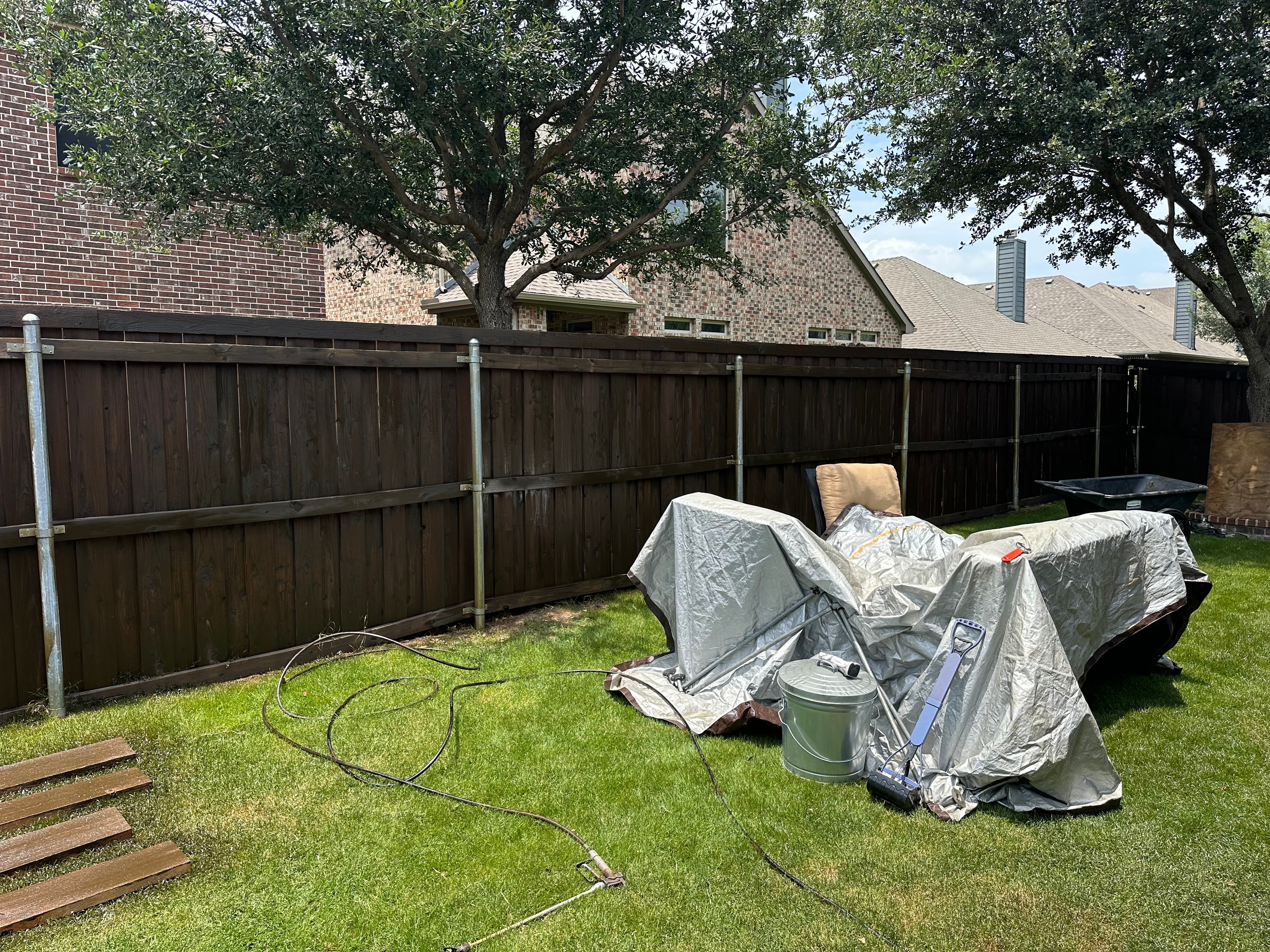 Completed dark fence staining — North Texas