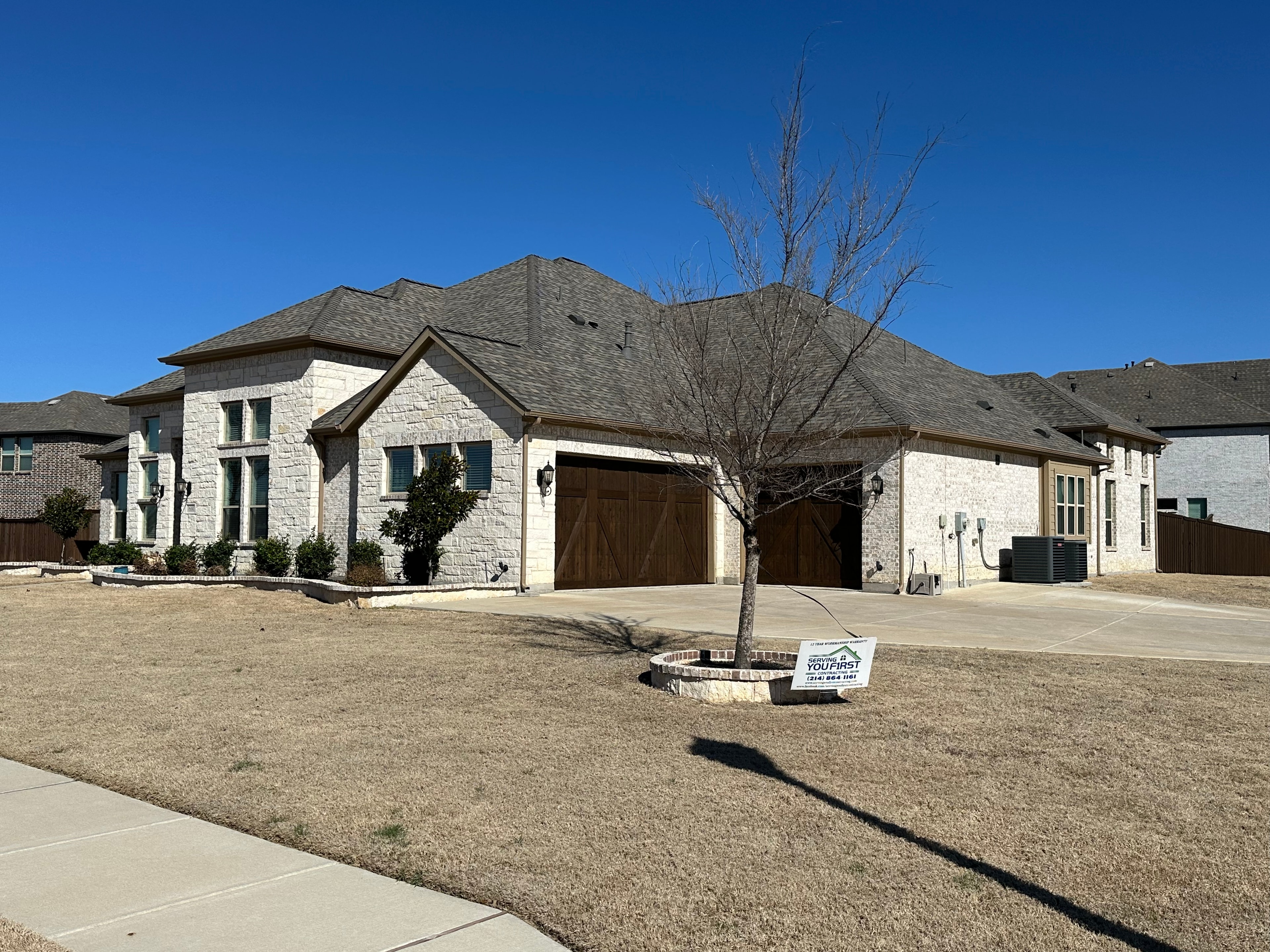 Completed roof on stone home — North Texas