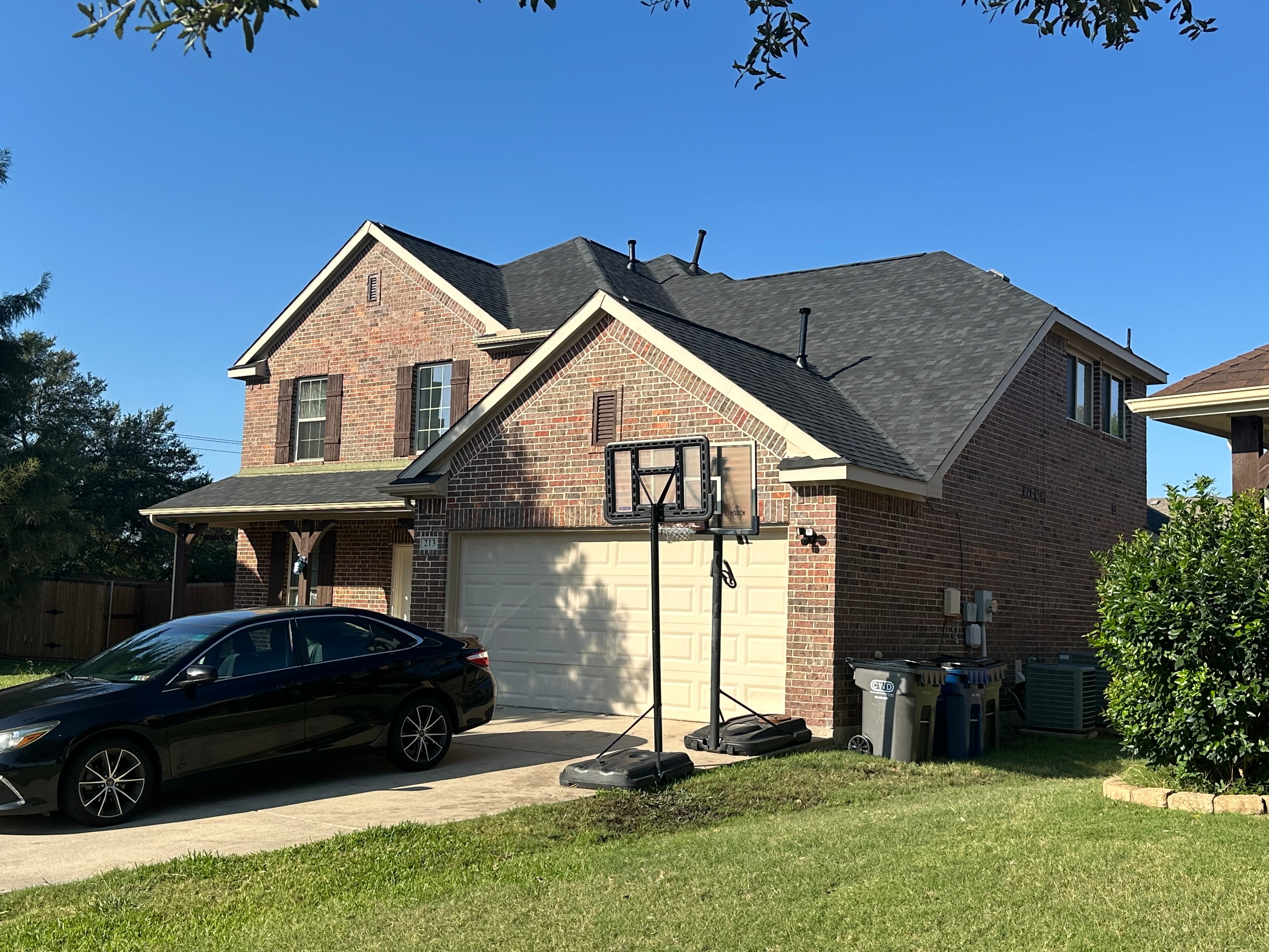Completed roof on two-story brick home